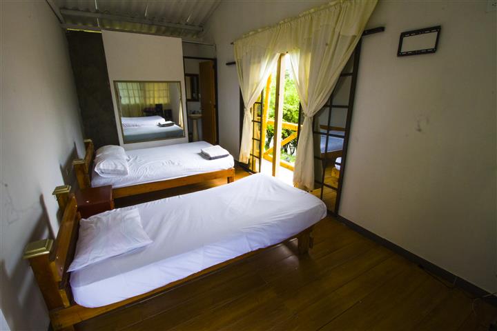 habitacion dos camas Cabañas Villa Lucia
